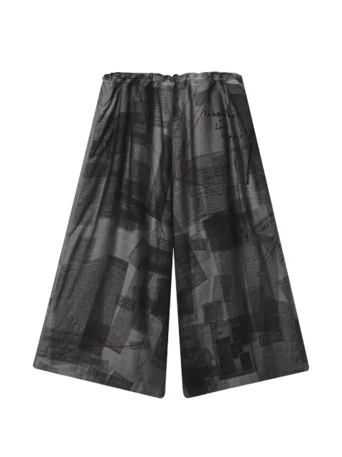 Y's pantalones anchos con estampado de periódico