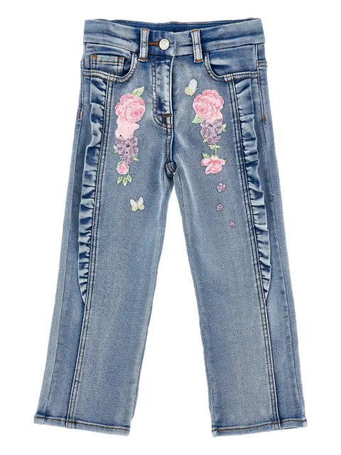 Monnalisa jeans con bordado floral y volantes