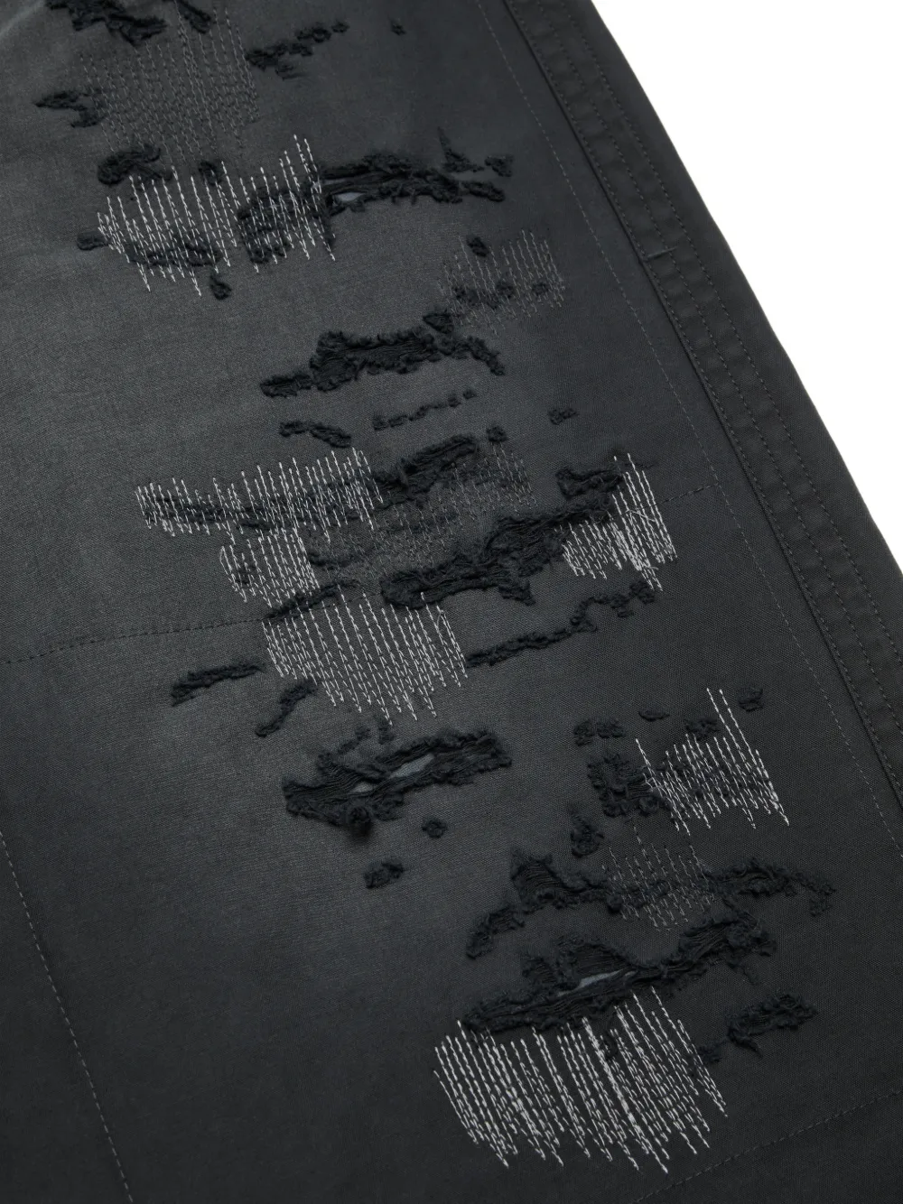 Acne Studios Mended gerafelde broek Zwart