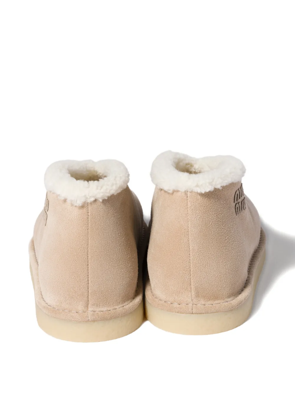 Miu embroidered-logo shearling boots Beige