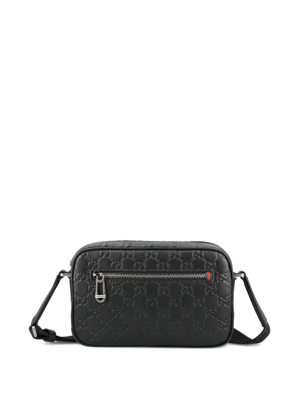 Gucci Small GG Emblem Embossed Shoulder Bag | Black | FARFETCH