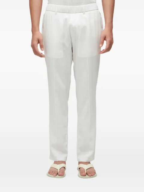 Osklen pantalon à taille élastiquée