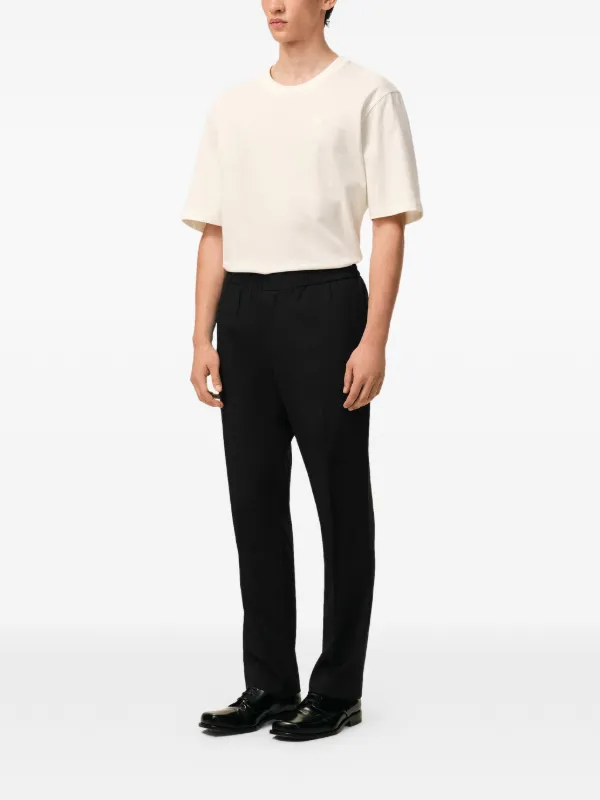 AMI Paris Wool Elasticated Waist Trousers | Black | FARFETCH