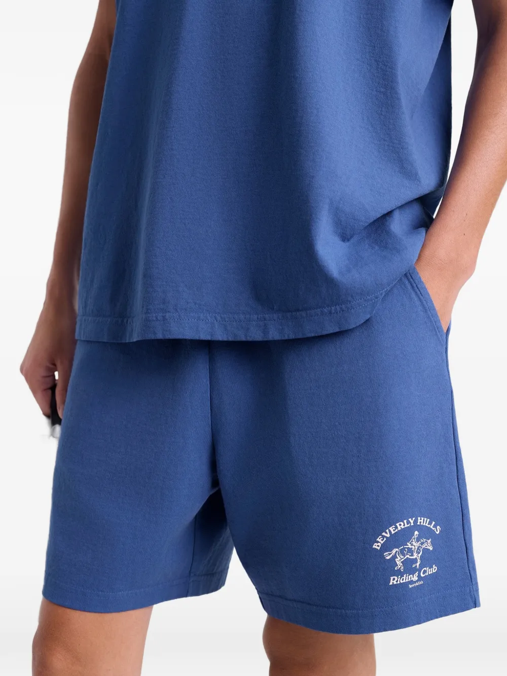 Sporty & Rich BH Riding Club shorts met grafische print Blauw