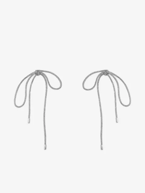 AREA crystal-knot long earrings