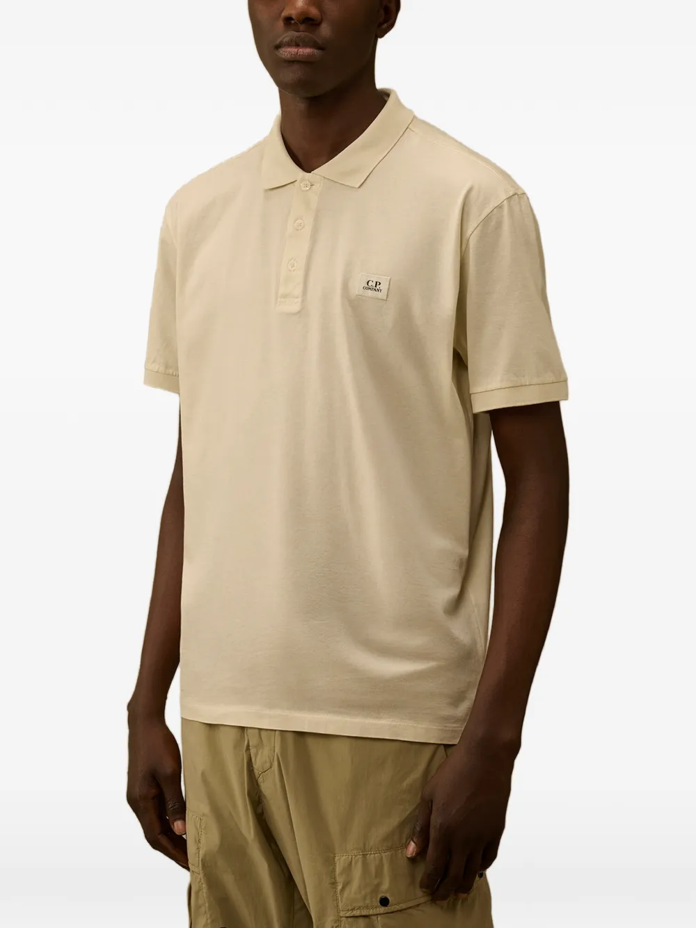 C.P. Company Poloshirt met logodetail en knopen Geel