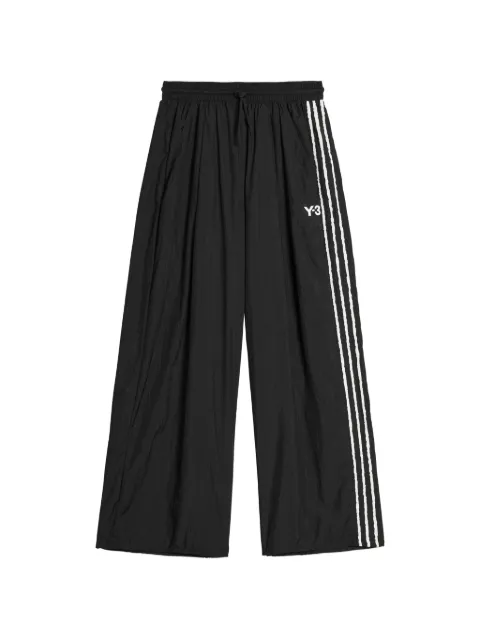Y-3 pantalones con tres rayas y logo estampado