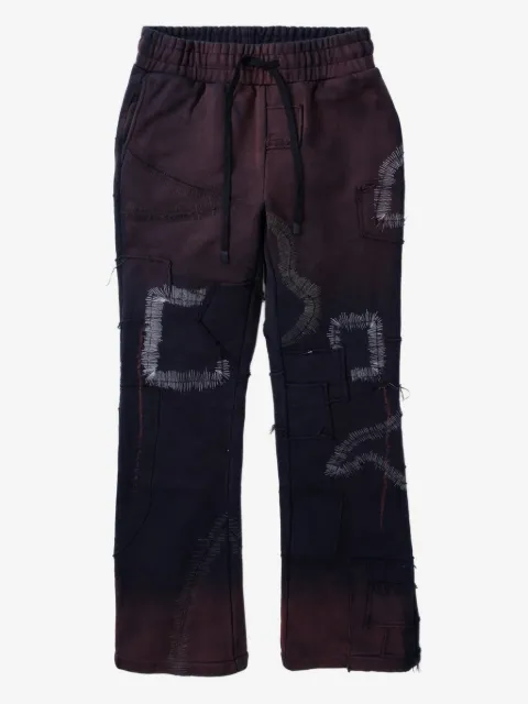 Who Decides War pants con diseño patchwork