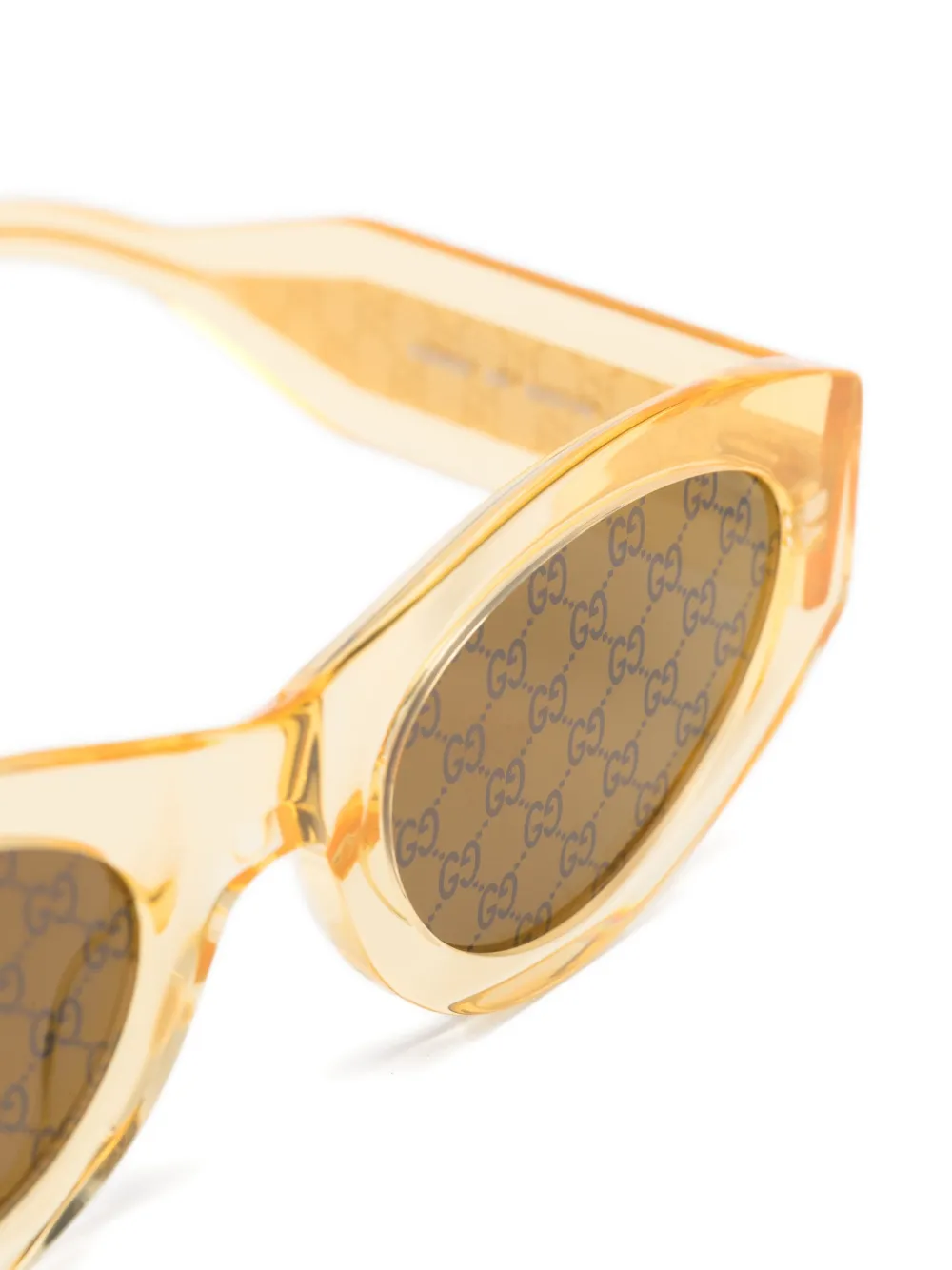 Gucci Eyewear Zonnebril met ovalen montuur Beige