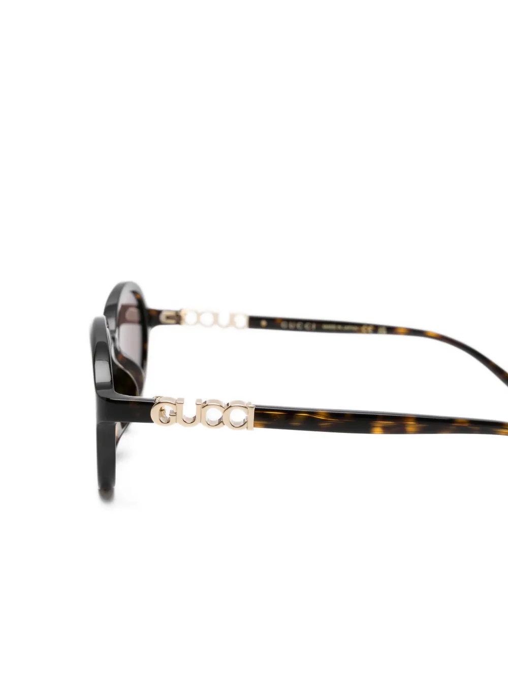 Gucci Eyewear Zonnebril met ovalen montuur en logodetail Bruin