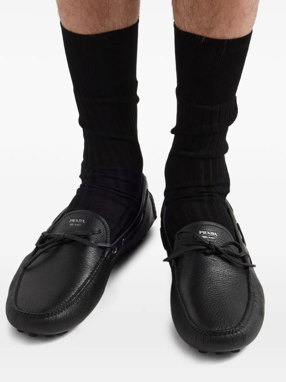 Prada Leren bootschoenen met logoprint Zwart