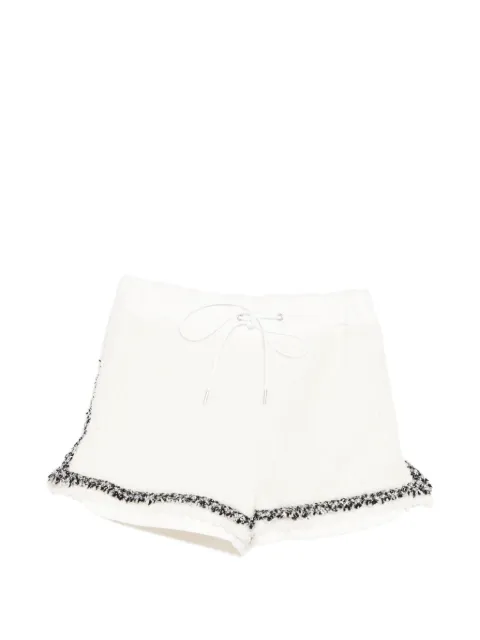 sacai shorts con ribete de bouclé