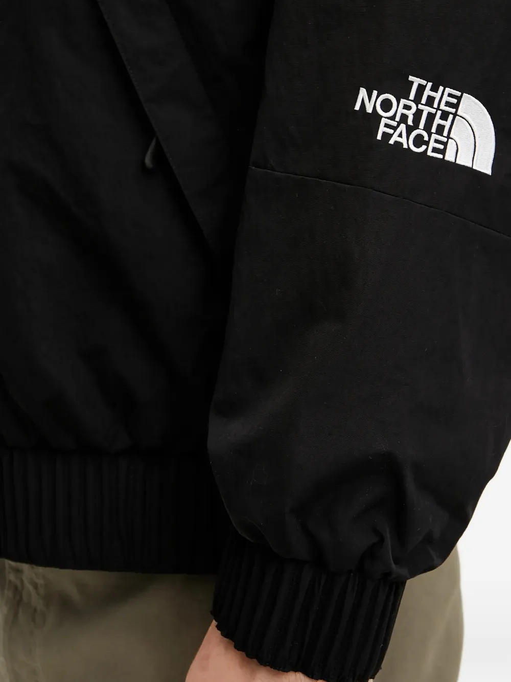 The North Face NSE bomberjack met logo Zwart