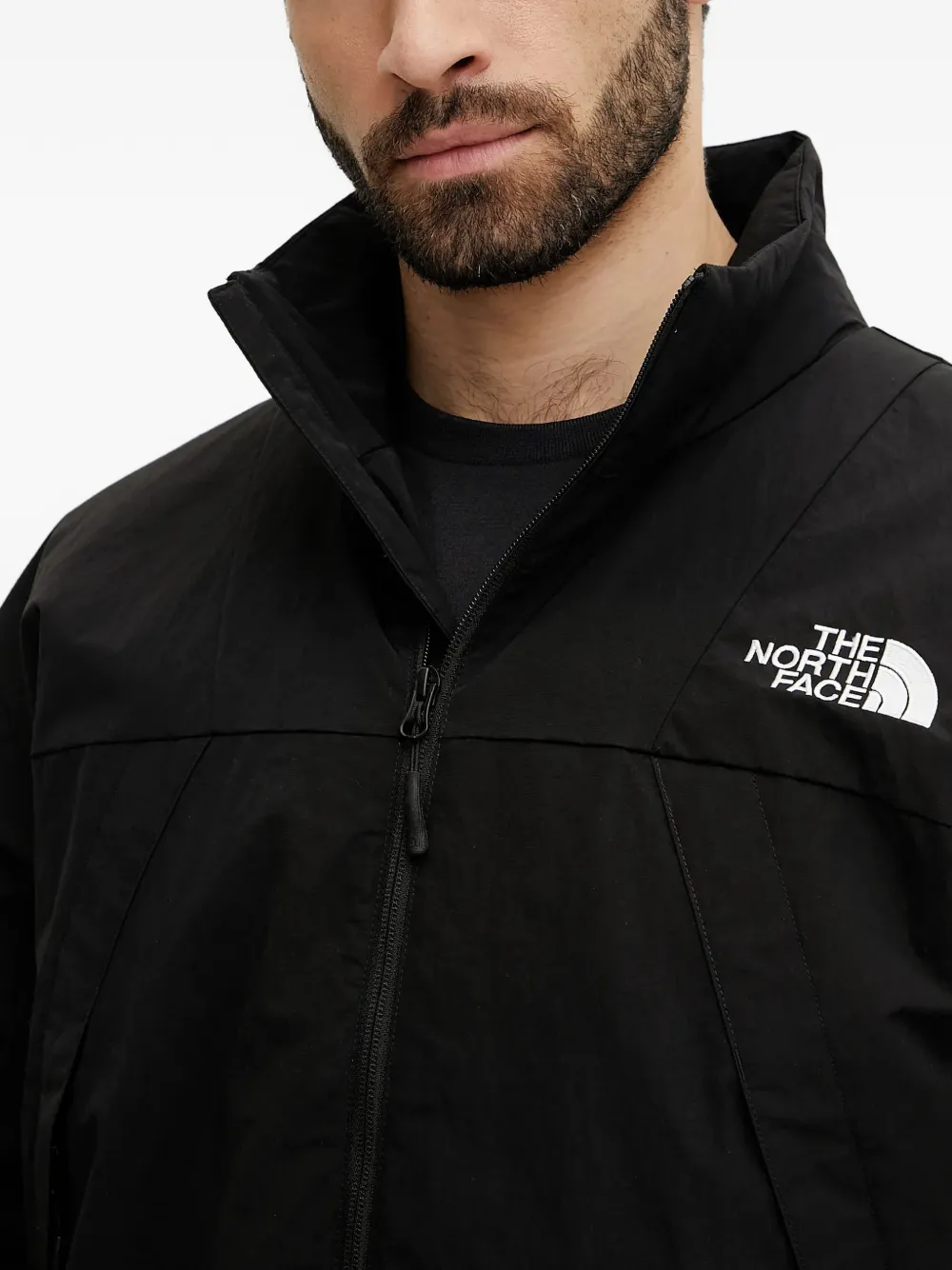 The North Face NSE bomberjack met logo Zwart