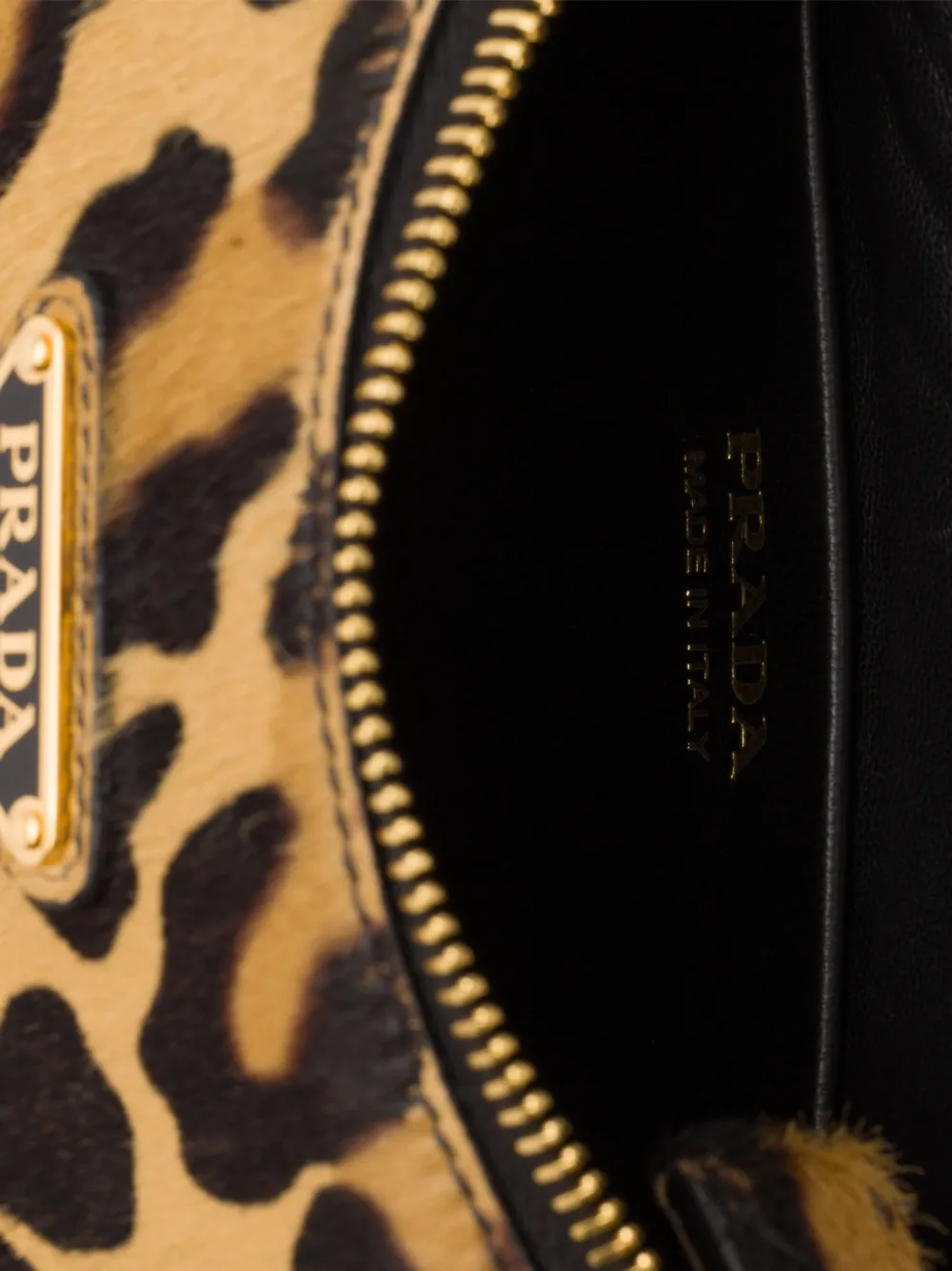 Prada Kleine Arqué leren schoudertas met print Beige