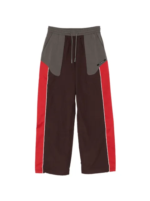 Andersson Bell logo-patched colour-block track pants