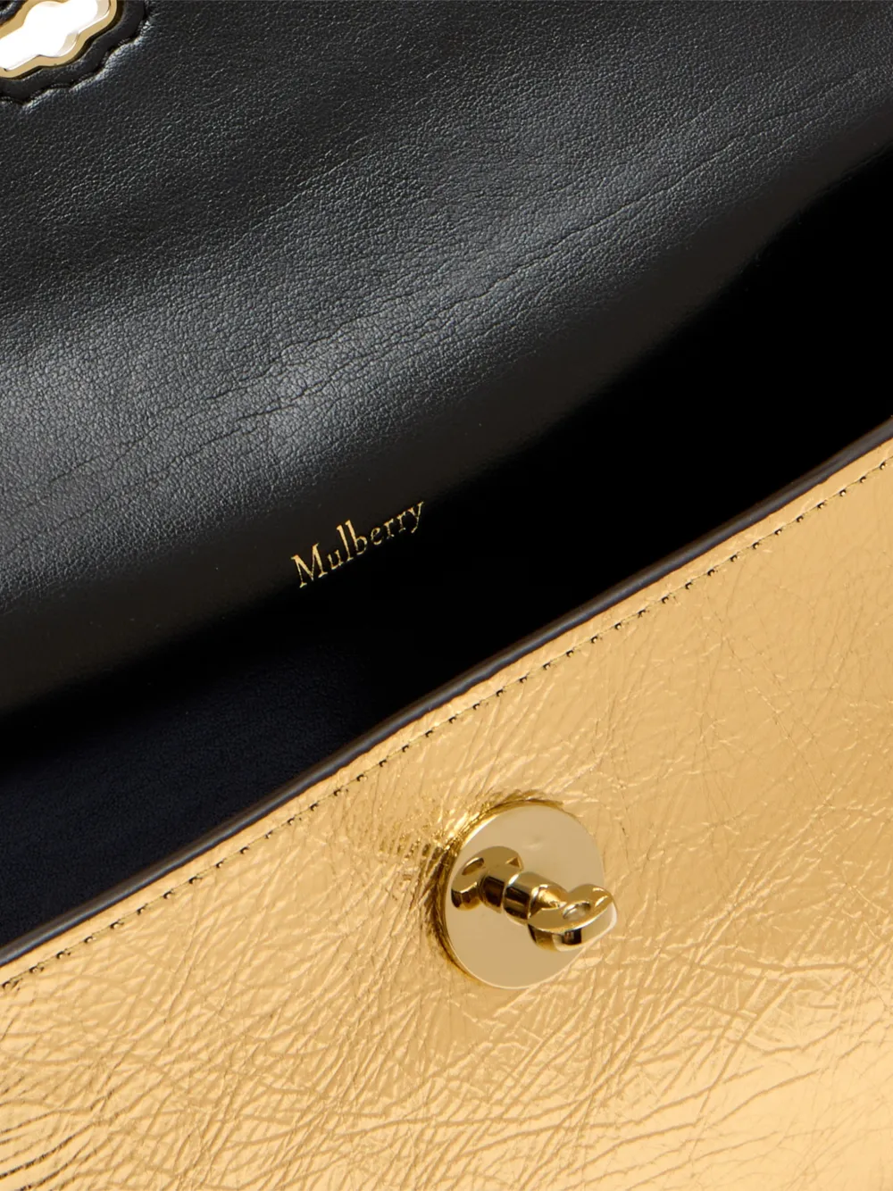 Mulberry Darley gouden clutch met draaislot