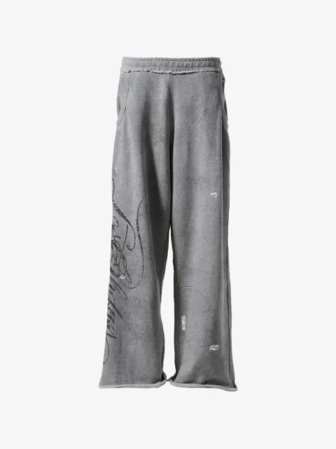 LOSTSHDWS distressed-script track pants