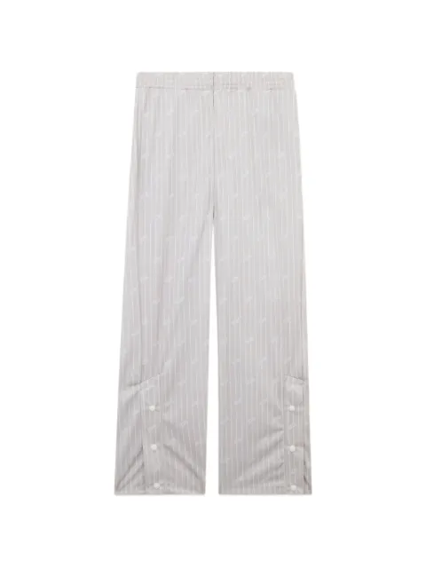 GCDS pants con motivo de rayas diplomáticas y logo