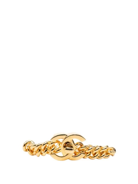 CHANEL Pre-Owned pulsera bañada en oro con cierre giratorio y logo CC 1990-2000