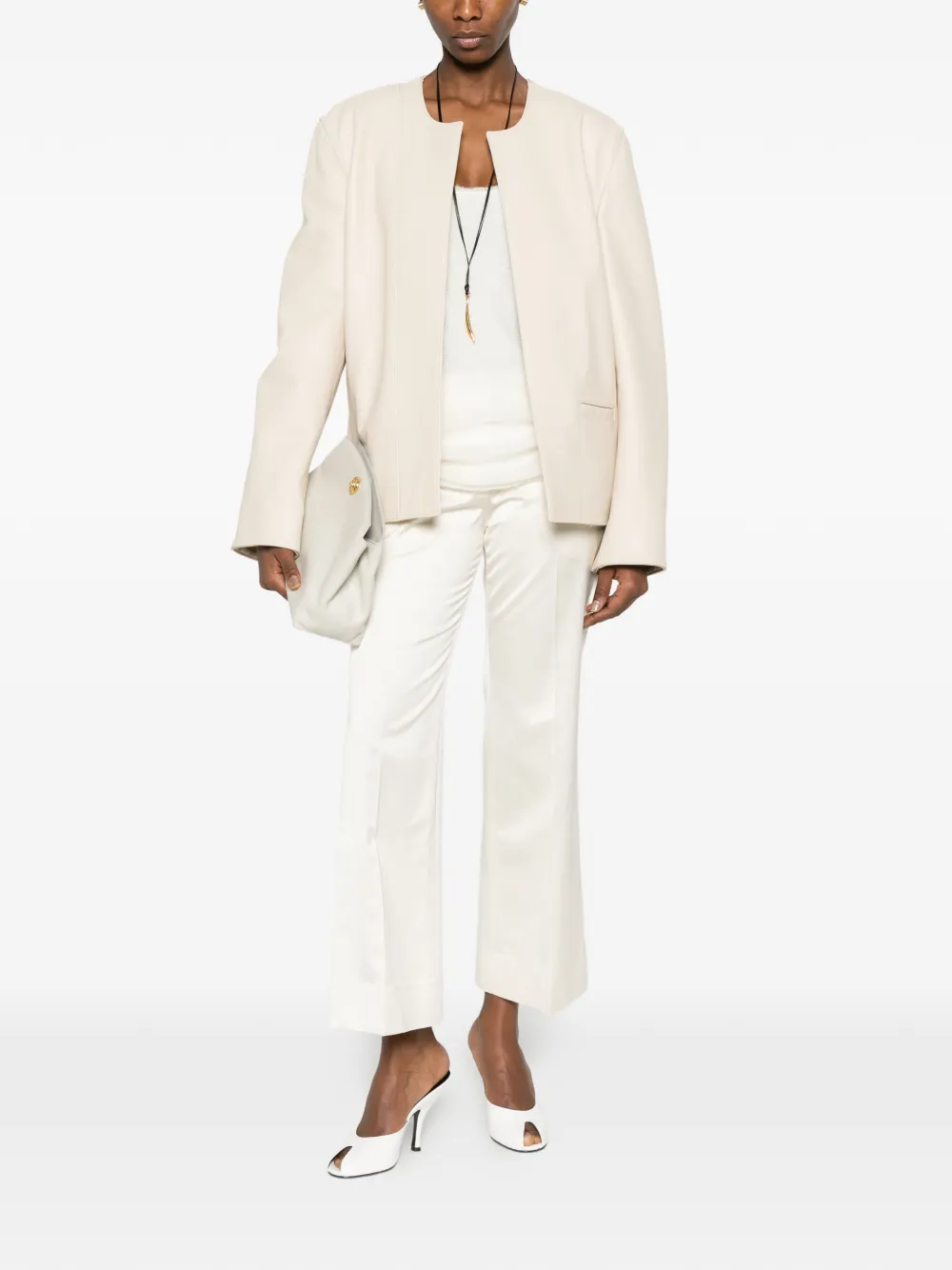 TOTEME Kick flare broek met gerafelde afwerking Beige