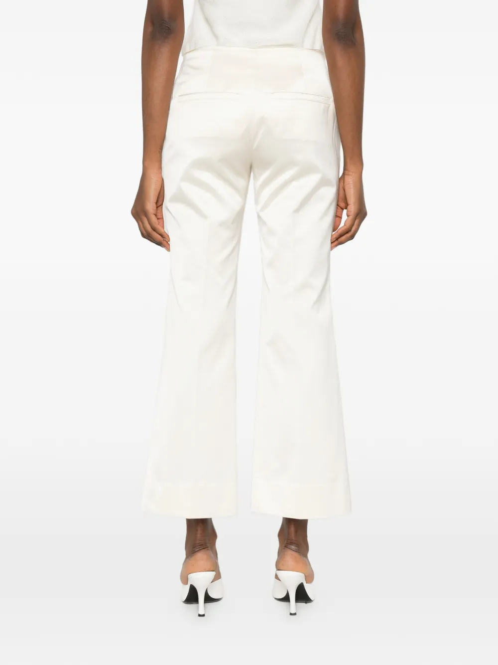 TOTEME Kick flare broek met gerafelde afwerking Beige