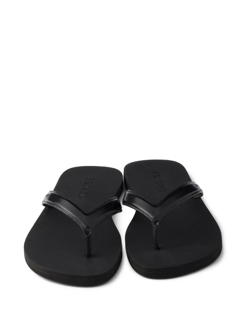Prada Leren teenslippers met logo-reliëf Zwart