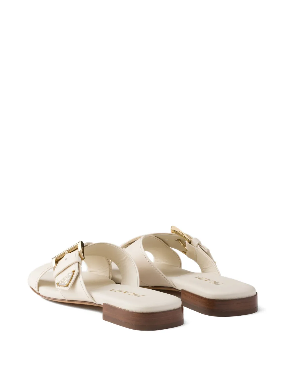 Prada Leren slippers met gekruiste bandjes Beige