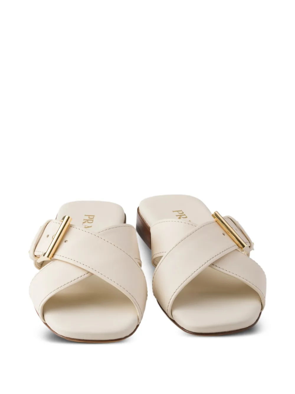 Prada Leren slippers met gekruiste bandjes Beige