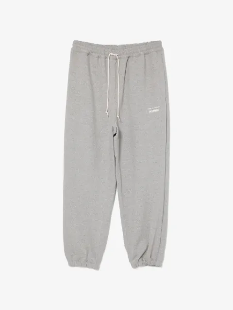 Comme des Garçons Homme pantalones con logo estampado
