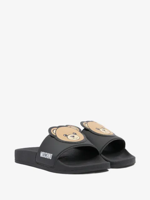 Moschino Kids flip flops con apliques