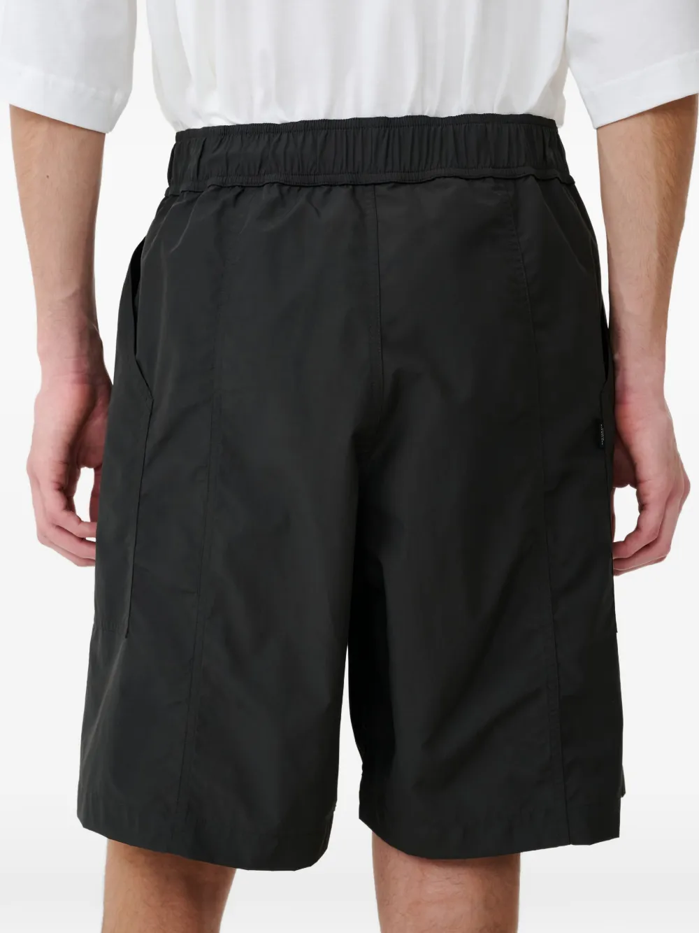 Studio Nicholson Elastische shorts Zwart