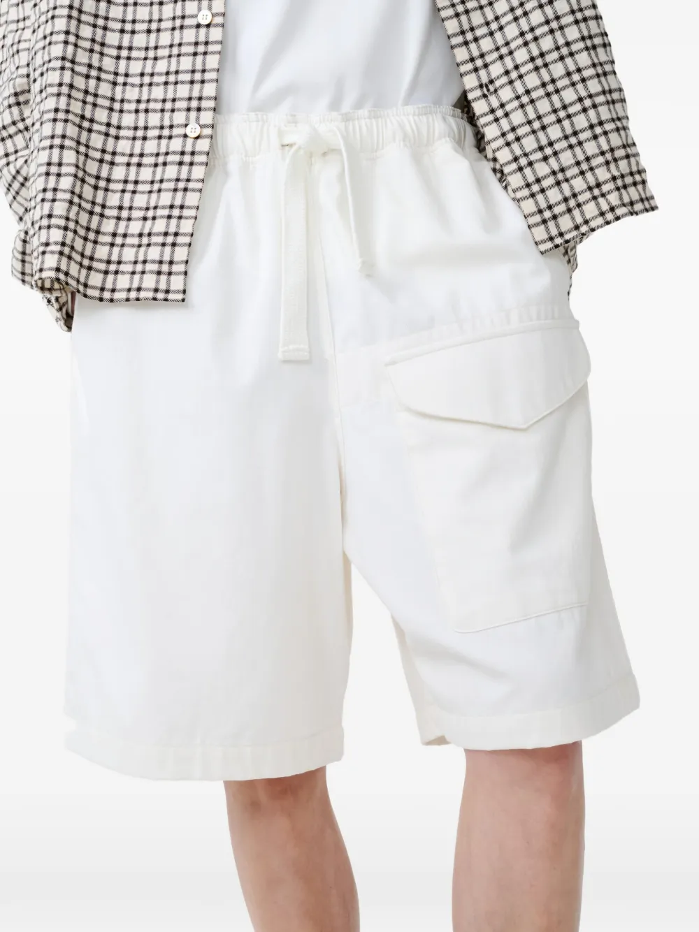 Studio Nicholson Ikaria shorts met klepzak en trekkoord Beige