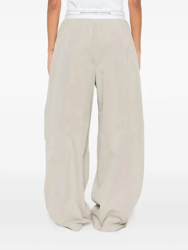 Alexander Wang logo-waistband Pleated Trousers | Green | FARFETCH