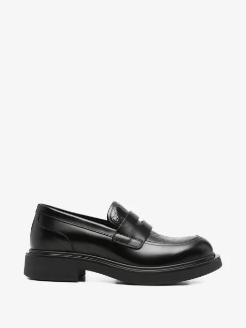 Gucci monogram-debossed loafers
