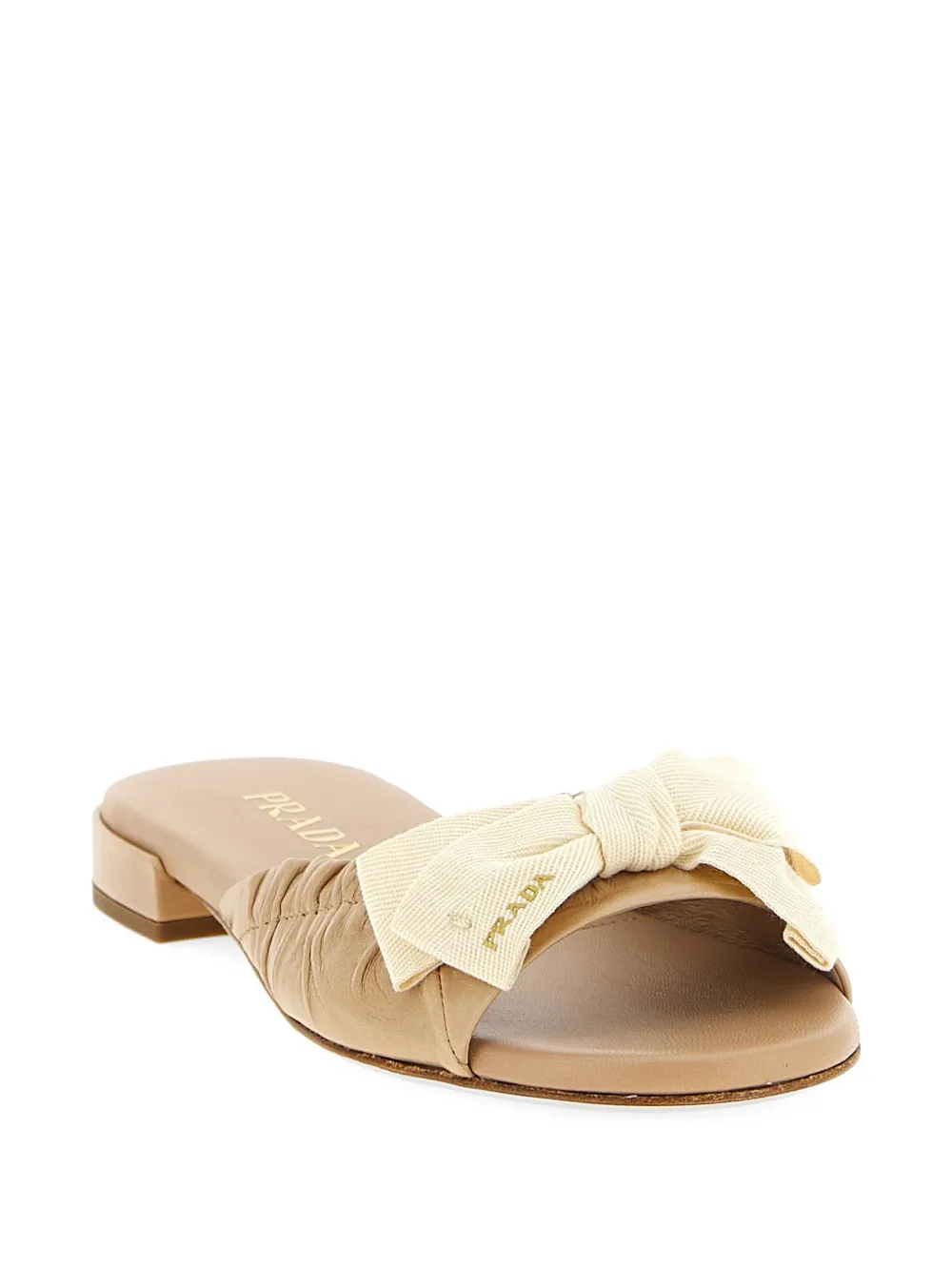 Prada Leren slippers met strikdetail Beige