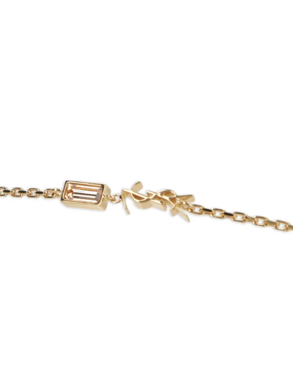 saint lauren paris ブレスレット  ゴールド ロゴ Saint Laurent ロゴチャーム ブレスレット | ゴールドトーン | FARFETCH JP