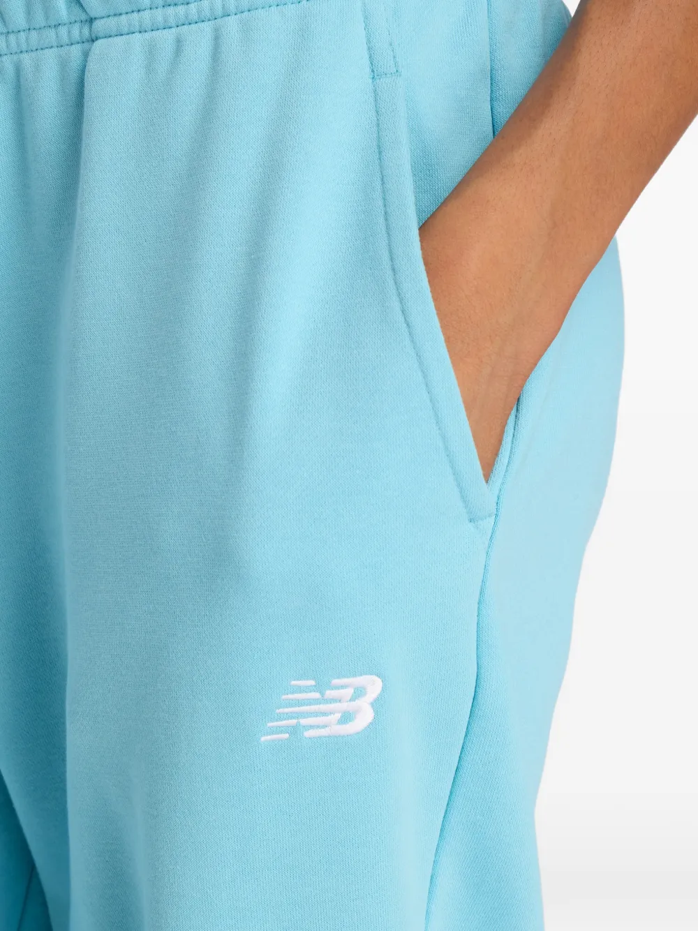 New Balance Trainingsbroek met logo Blauw