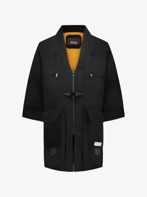 Mostly Heard Rarely Seen manteau à col v