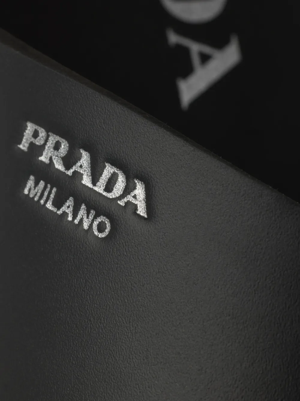 Prada crisscross rubber slides Zwart