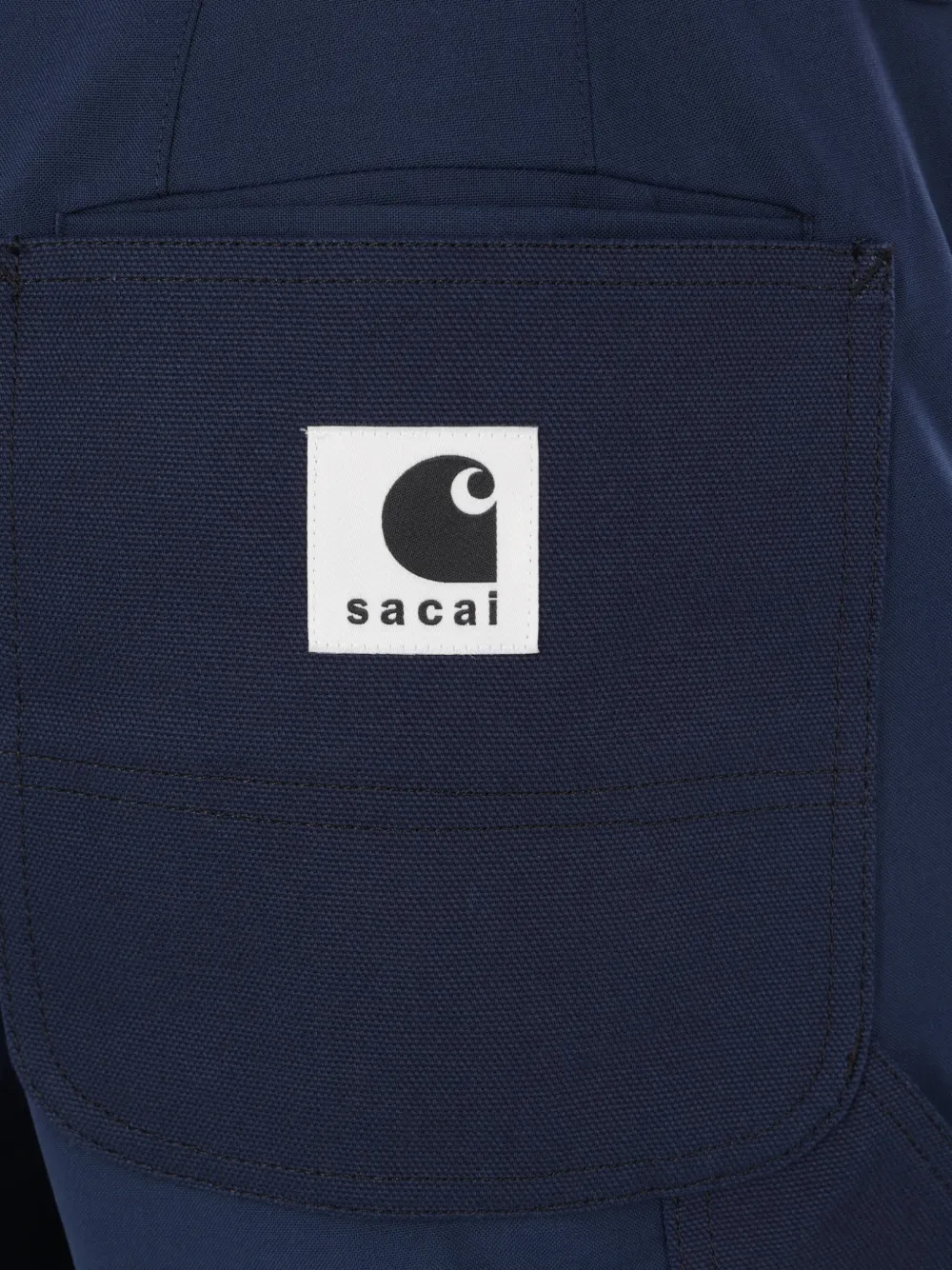 sacai x Carhartt Wip broek met riemlus en patch Blauw