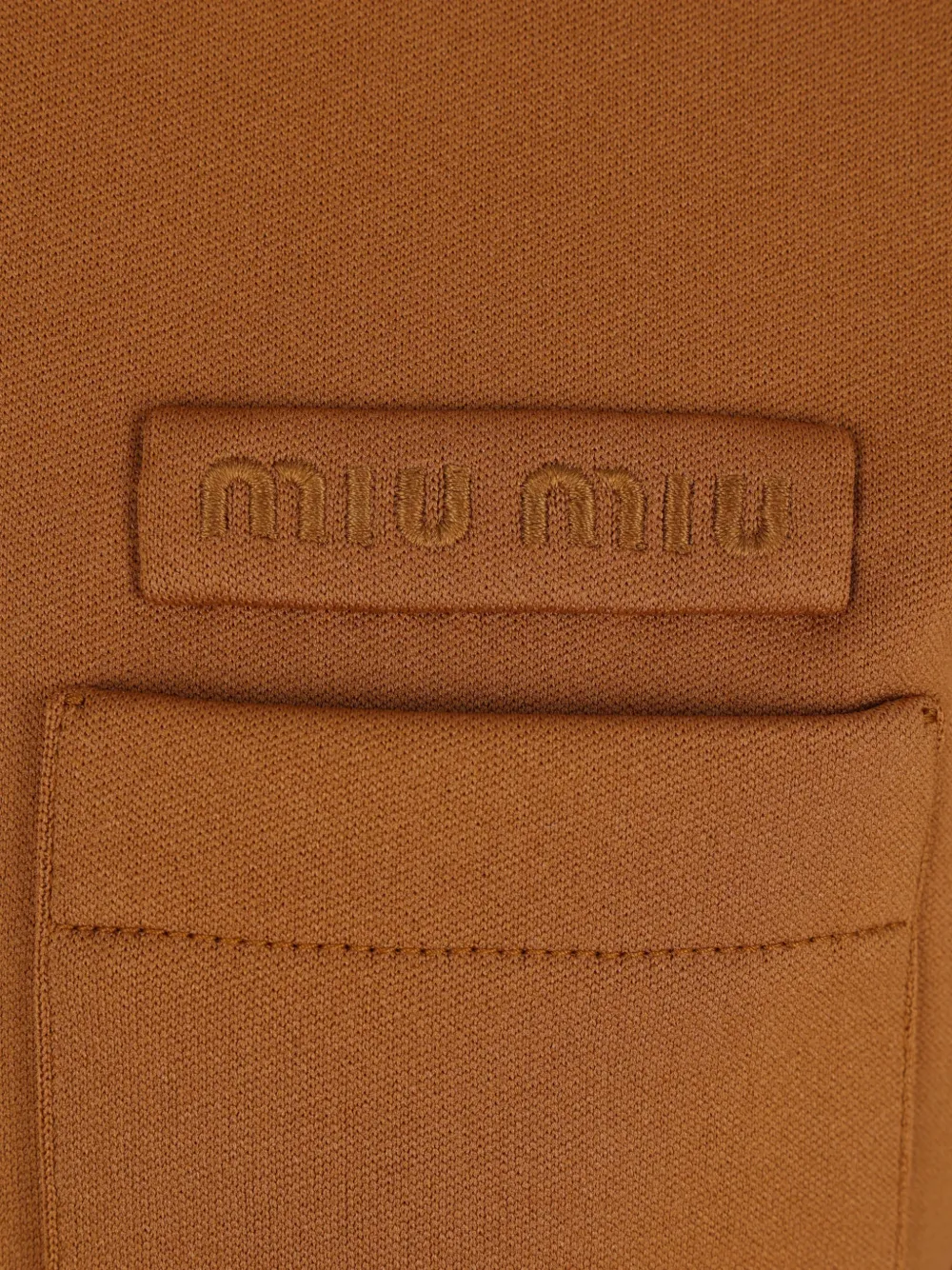 Miu Poloshirt met zak en korte mouwen Bruin