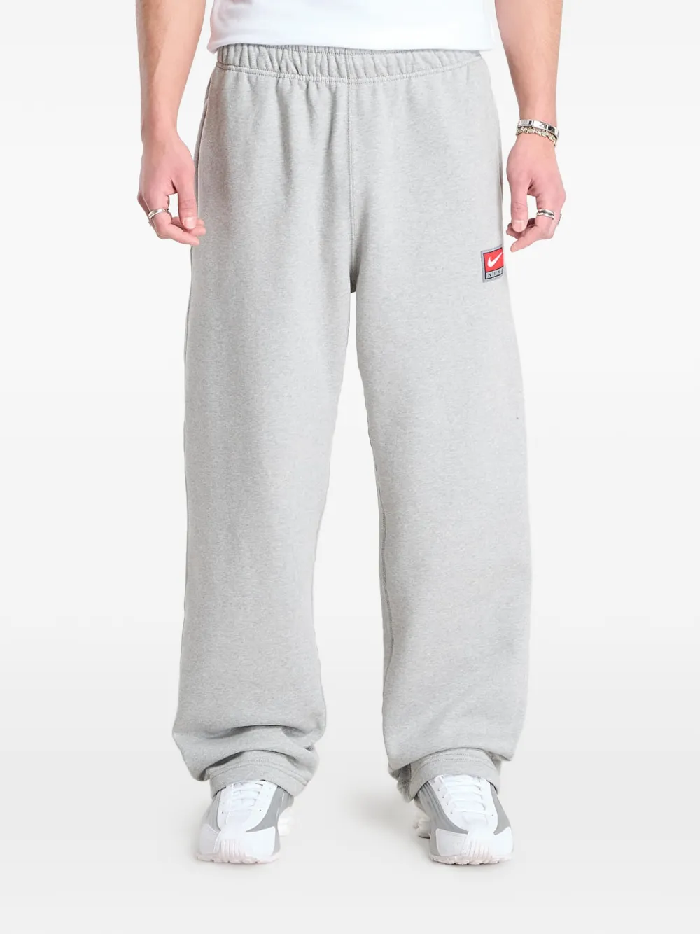 Nike Solo Swoosh open-hem track pants - Grigio