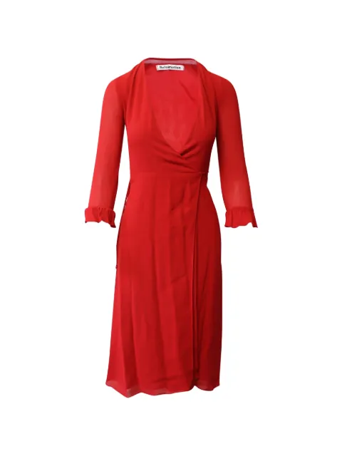 Reformation vestido midi con volantes y detalle cruzado