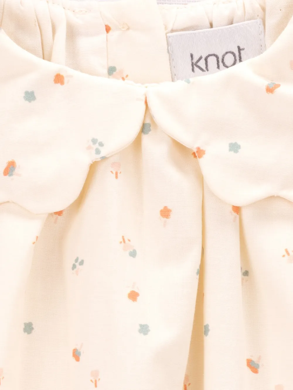 Knot Mary gewelfde romper met bloemen Beige