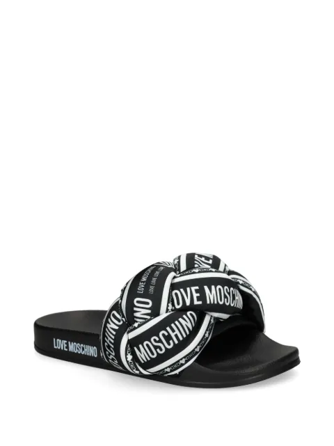 Love Moschino sandalias trenzadas con logo estampado