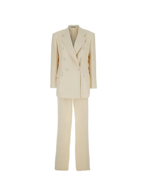 Tagliatore traje con doble botonadura