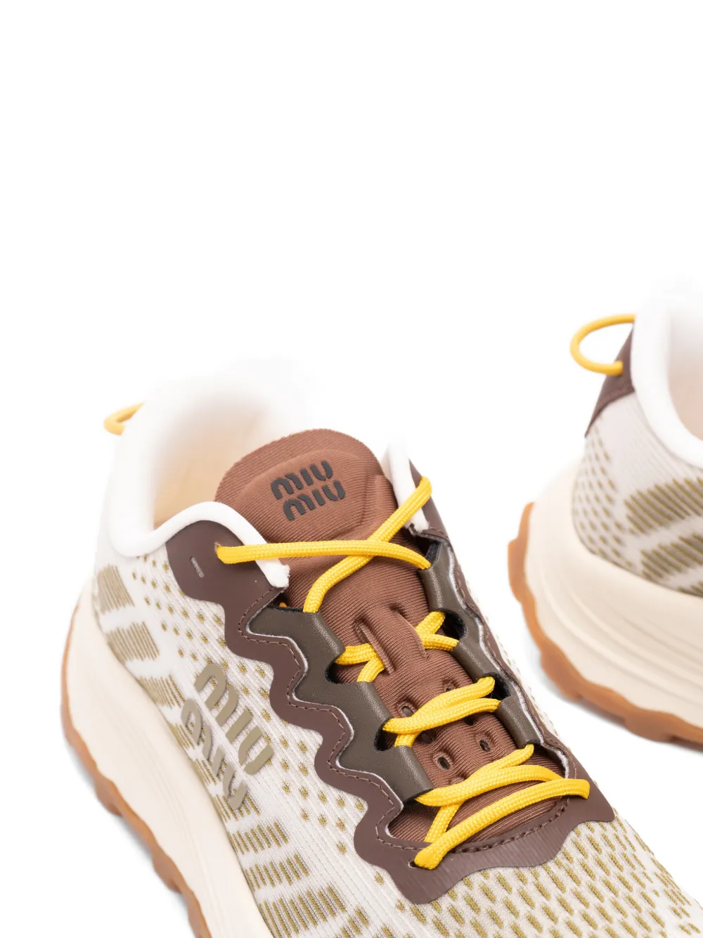 Miu Sneakers met logopatroon Beige