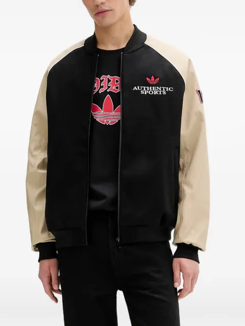 adidas chamarra bomber SST con logo bordado