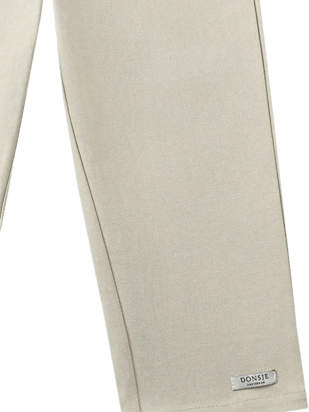 Donsje Kassim bear-embroidered trousers Beige